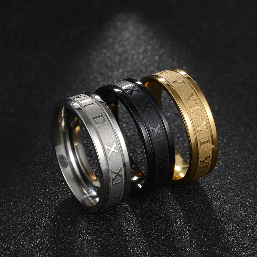 Stainless Steel Numeral Rings in silver, black, and gold for modern unisex fashion style.