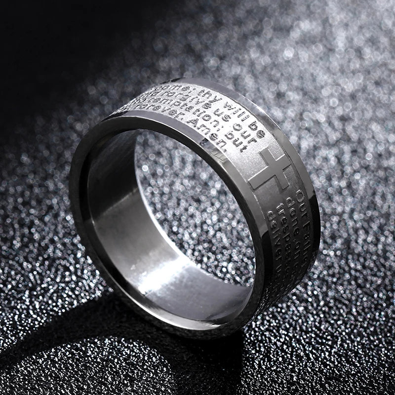 Bible Scripture Titanium Ring featuring engraved cross design on a sleek metallic surface.
