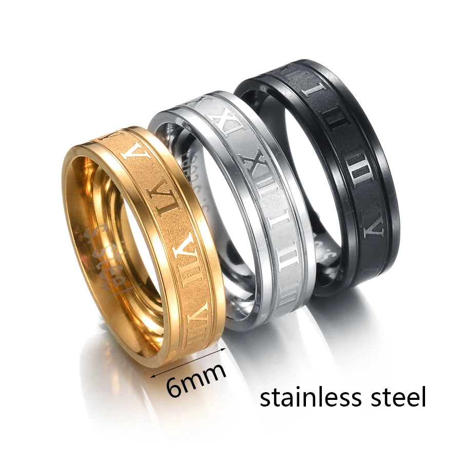 Stainless Steel Numeral Rings in gold, silver, and black showcasing modern unisex fashion design and engraved details.