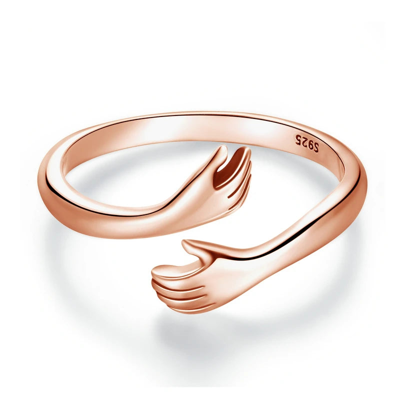 Sterling Silver Warmth Adjustable Ring featuring hand-hug design, symbolizing care and affection.
