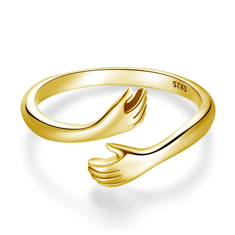Sterling Silver Warmth Adjustable Ring featuring a unique hand-hug design symbolizing love and connection.