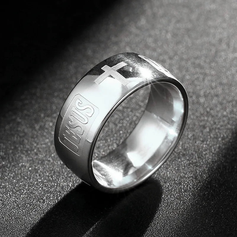 Bible Scripture Titanium Ring showcasing a silver band engraved with 'JESUS' and a cross.