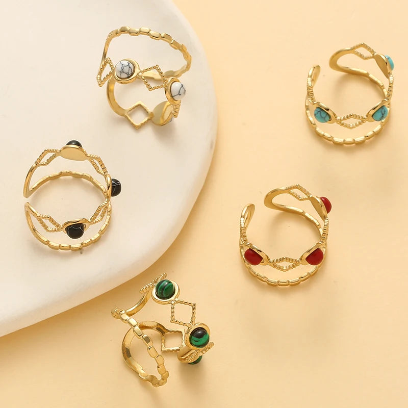 Timeless trendy stone layered ring - collection displayed on a neutral background featuring colorful stones and gold accents.