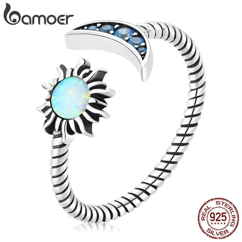 Authentic Silver Sun Moon Ring showcasing celestial design with opal stone and blue embellishments, crafted in 925 sterling silver.