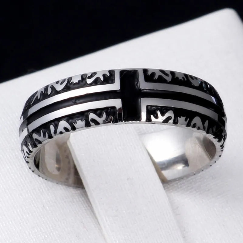 Bible Scripture Titanium Ring displayed on a stand, featuring a modern design with etched cross pattern.