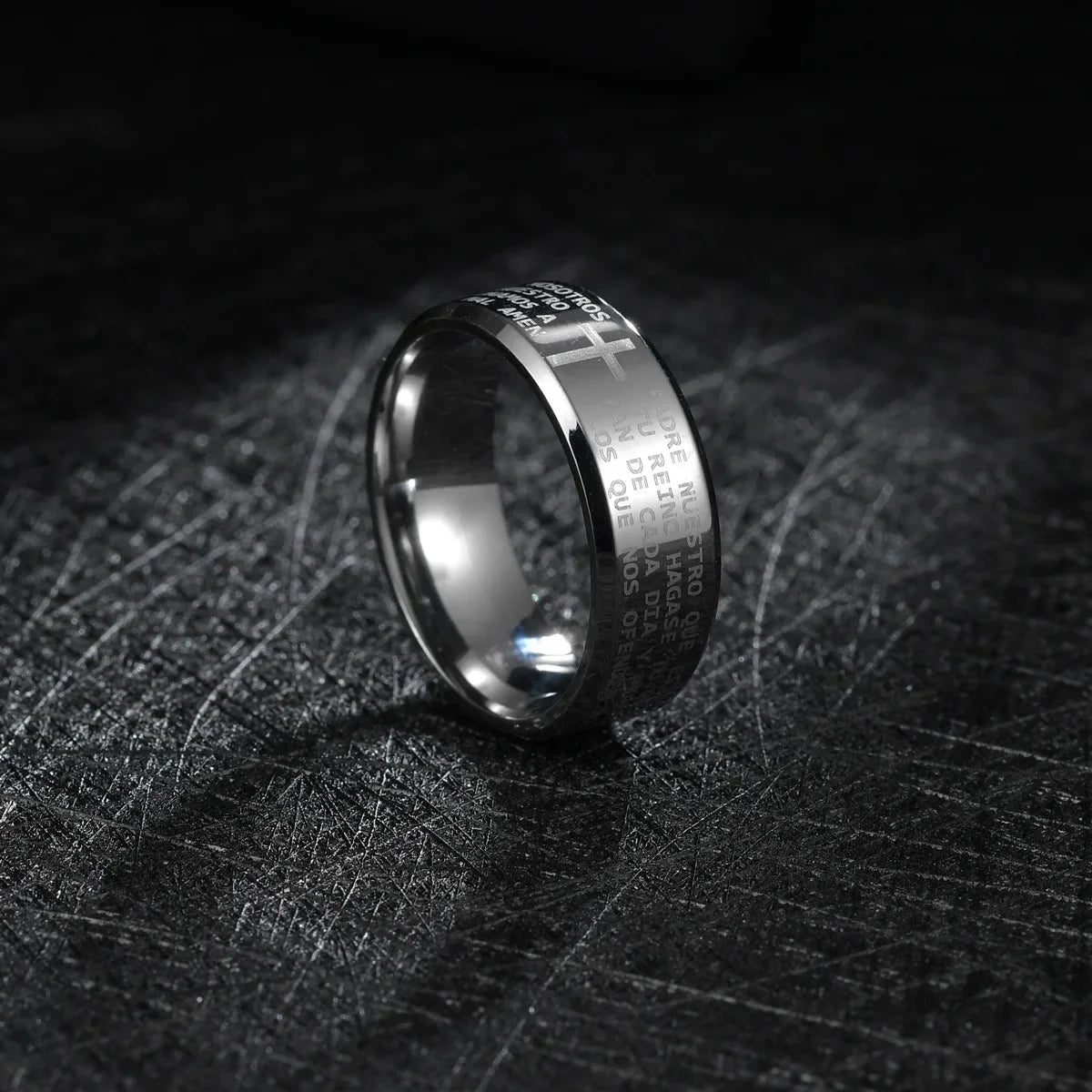 Bible Scripture Titanium Ring shown in a sleek design on a dark surface, highlighting its modern style and durability.