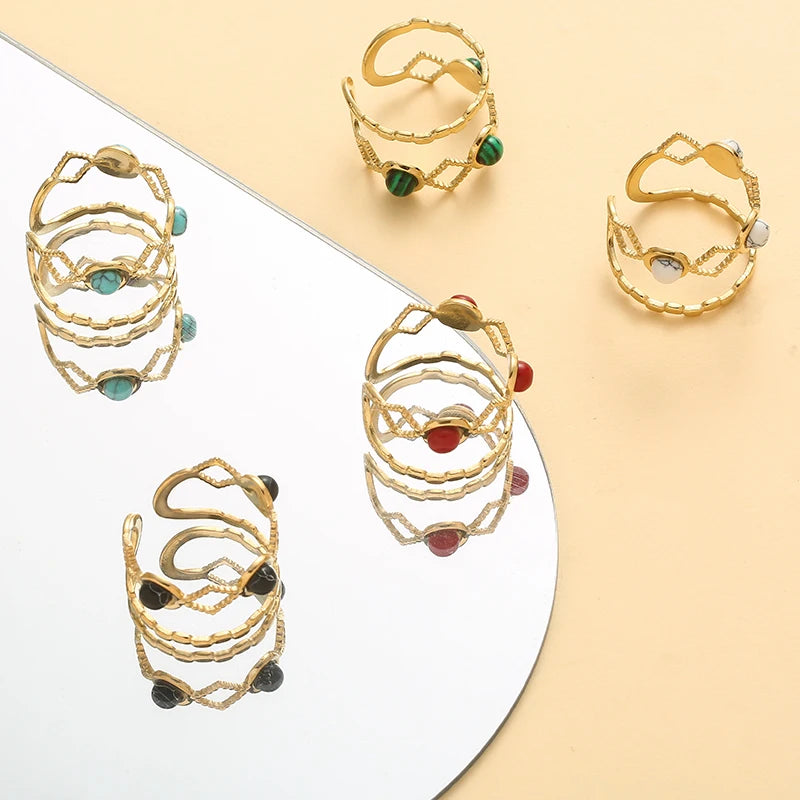 Timeless trendy stone layered ring - displayed in multiple styles with colorful stones on a reflective surface.