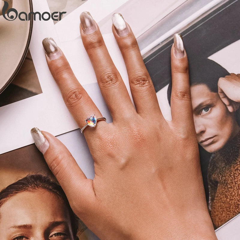 Luxury Sterling Silver Wedding Engagement Ring worn on a hand, showcasing its elegant design and radiant zircon centerpiece.